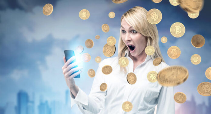 Surprised blonde woman, smartphone, bitcoin rain