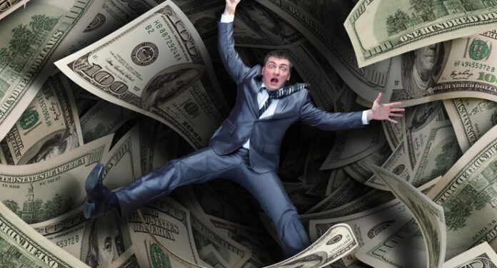 Businessman falling into financial tunnel